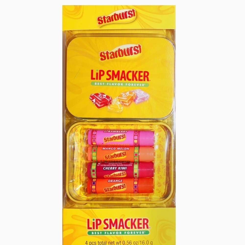 New in package starburst holiday tin w/ four lip glosses strawberry melon
